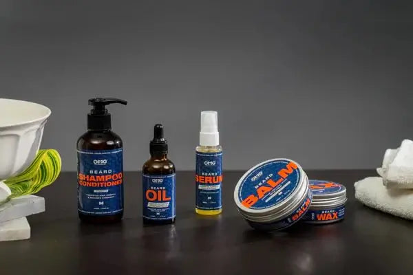 Premium beard care products from Infinity Market including beard shampoo, conditioner, oil, serum, balm, and wax on a gray background.