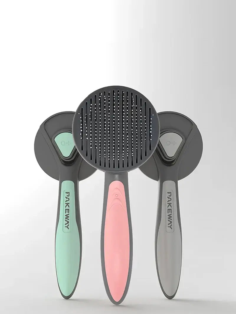 Pet grooming brush trio in pink, green, and gray with self-cleaning combs for cats, dogs, and rabbits.